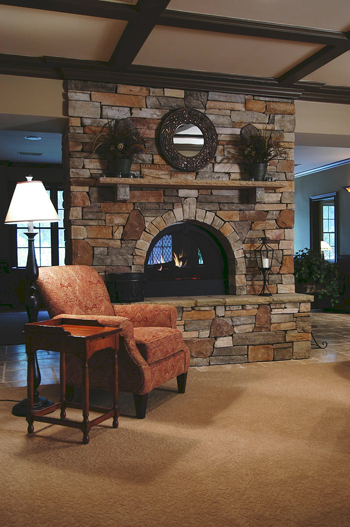 View of fireplace and coffered ceiling