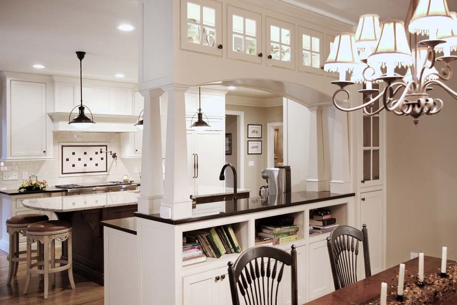 Kitchen with built-in bookcases and lighted display cases