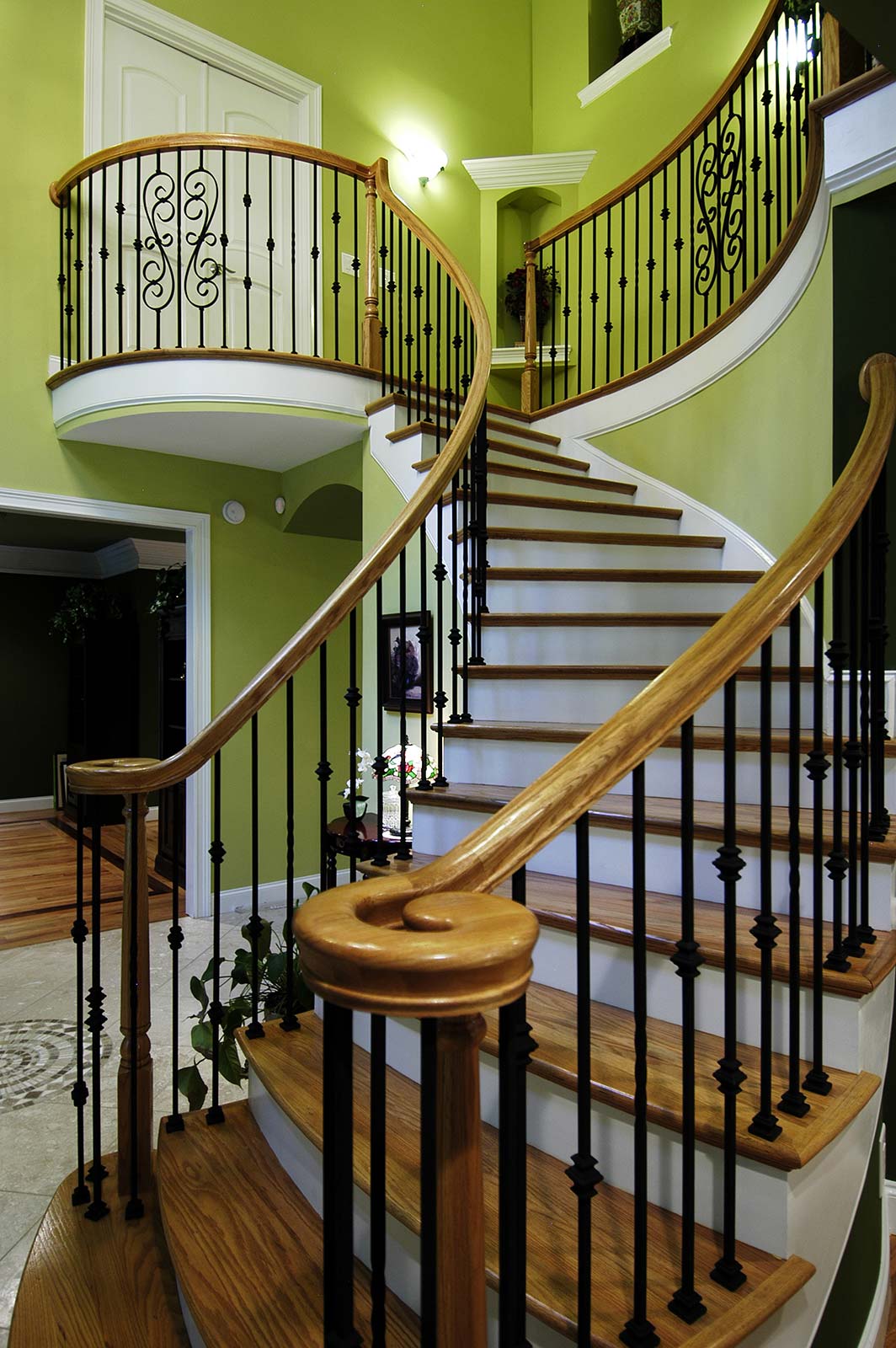 After remodeling view up curved stairway