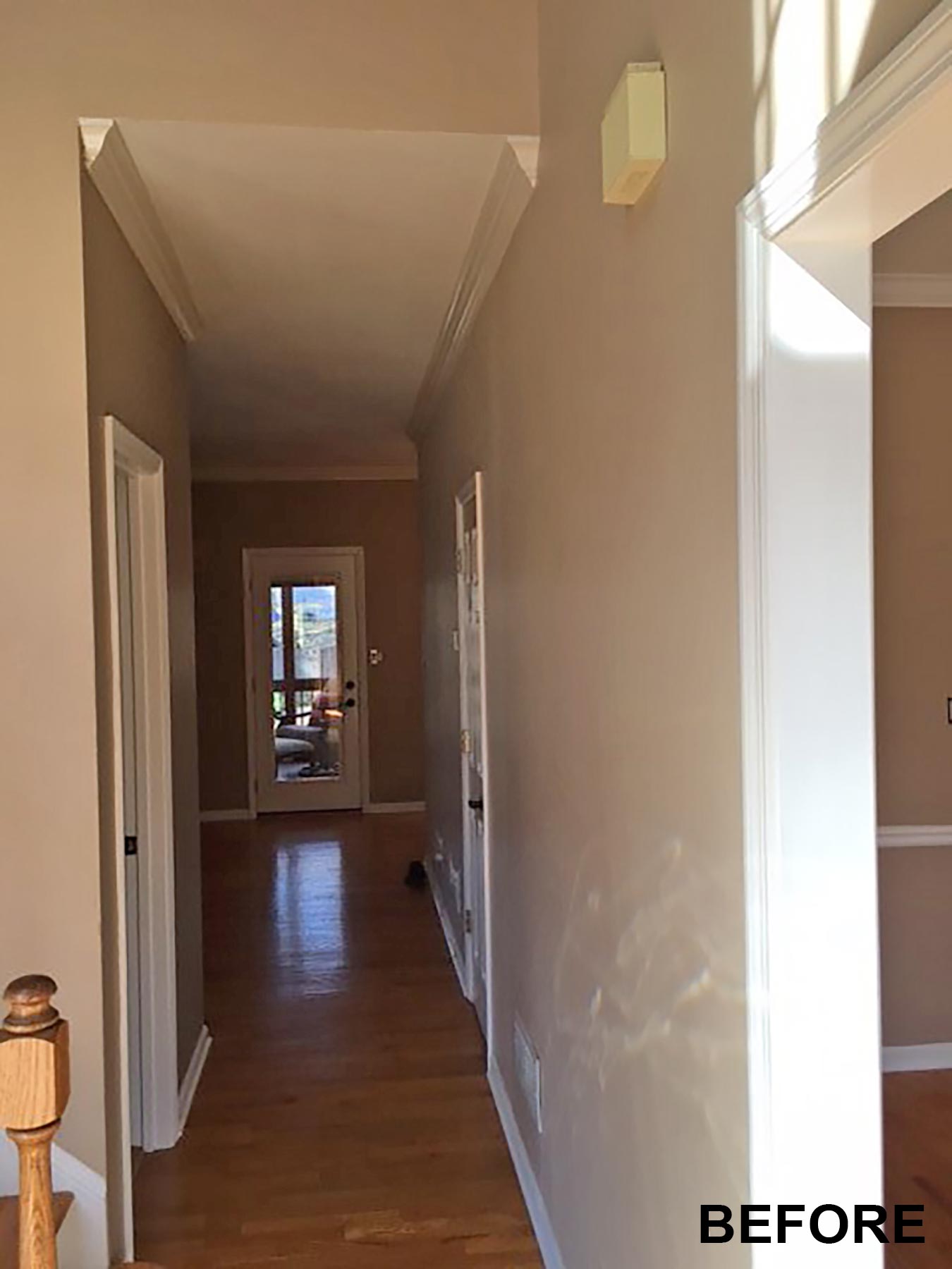 View down closed off hallway before remodeling